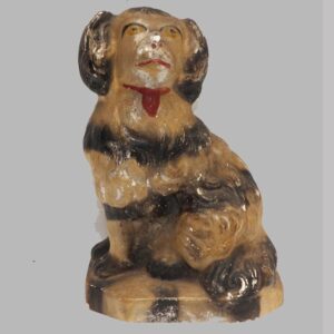 30-20946, Chalk figure of a seated spaniel polychrome paint black striping. $345