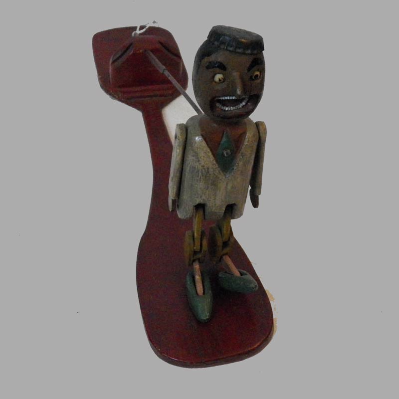 16-26484, Folky dancing man lap toy, carved wood polychrome paint, 20thc, 17"l. $775