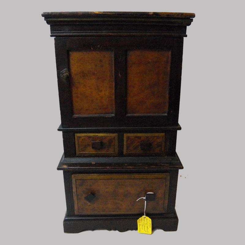 16-27551, Painted miniature cupboard, unusual form single door over three drawers, signed W.T.C., Petersburg NH 1891. 9" L by 17" H. $2,450