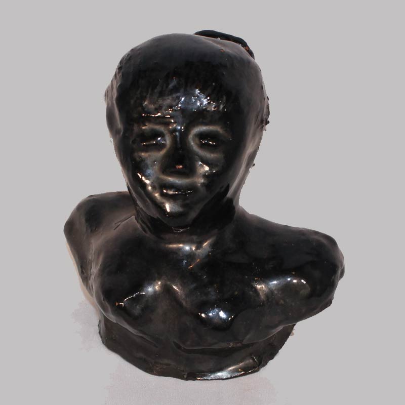 26-14173, Rare folk art PA Redware pottery profile of a woman, end of day piece, manganese glaze, 19th. 4"H. $2,400