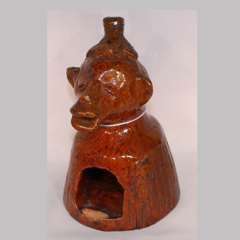 12-21185, Rare Redware pottery figural whimsey profile of a monkey with leaf hat manganese glaze, American 1850-75, Probably PA. 6" H. $2,950