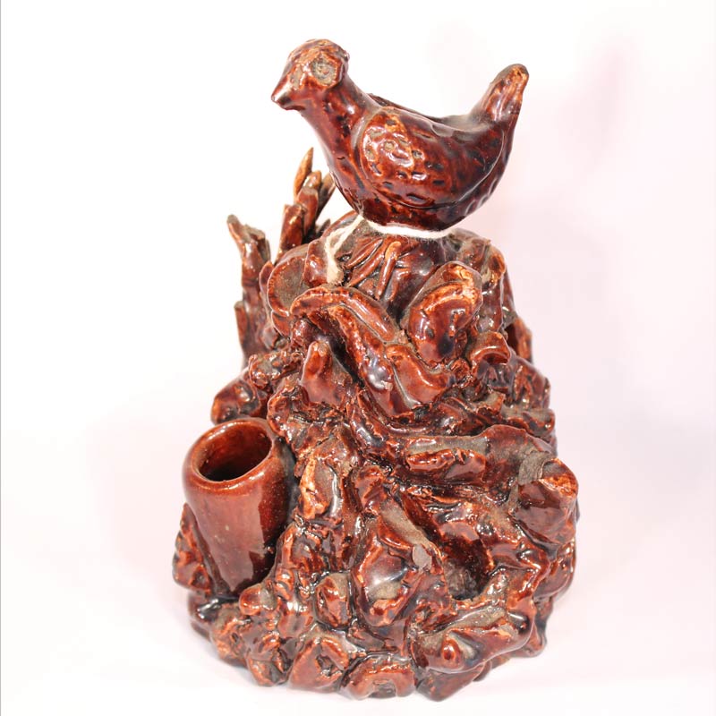 28-17489, Redware pottery ink or pip stand, a bird figure on mound, PA or Ohio, later 19th c, minor loss, 6 1/2" H. $1,295